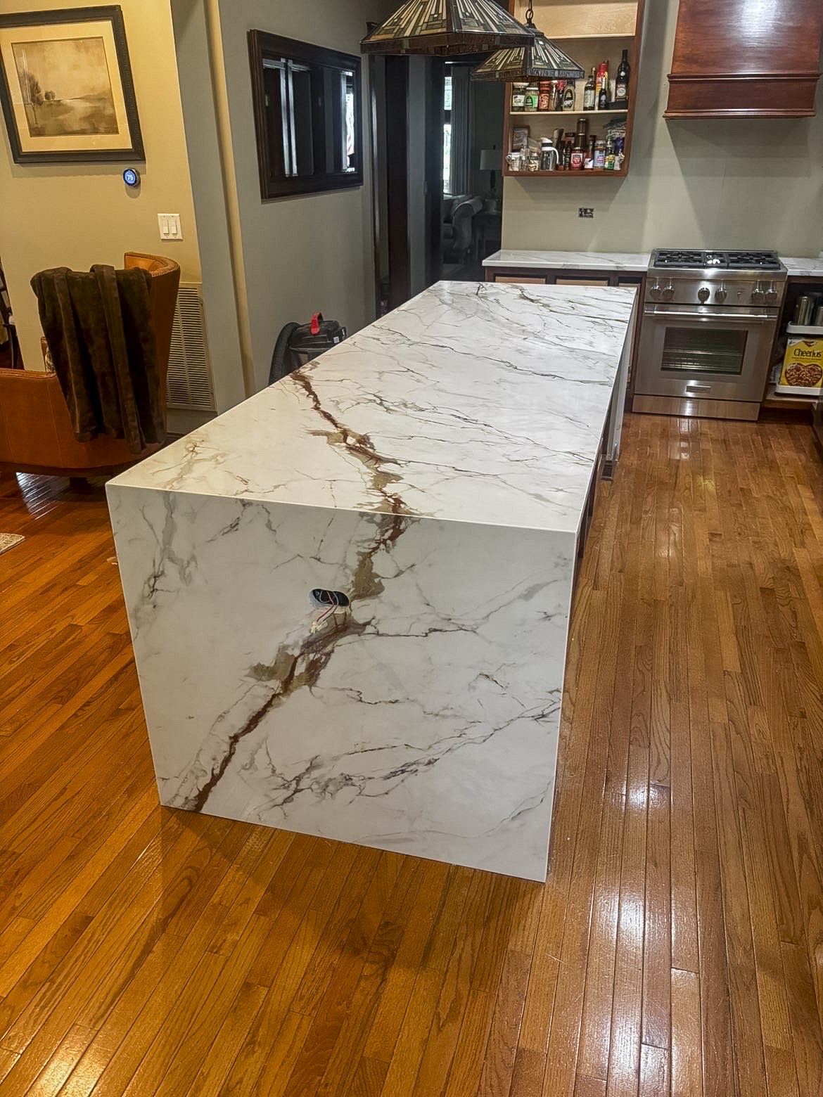 Waterfall marble kitchen island installed by Amici Stone